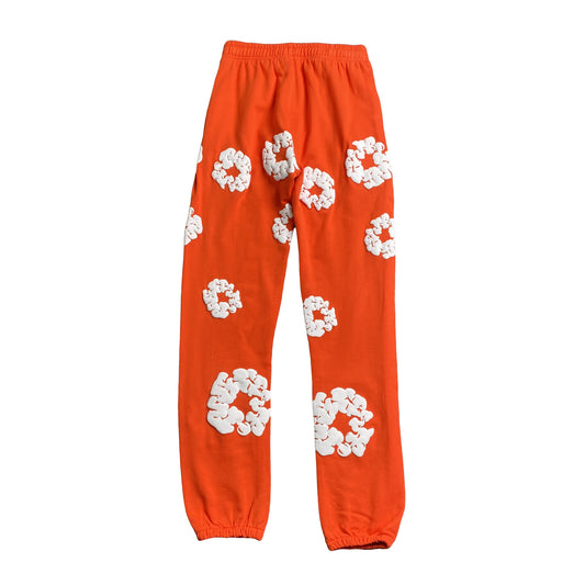 denim-tears-the-cotton-wreath-sweatpants-orange-2-Drip Store Argentina