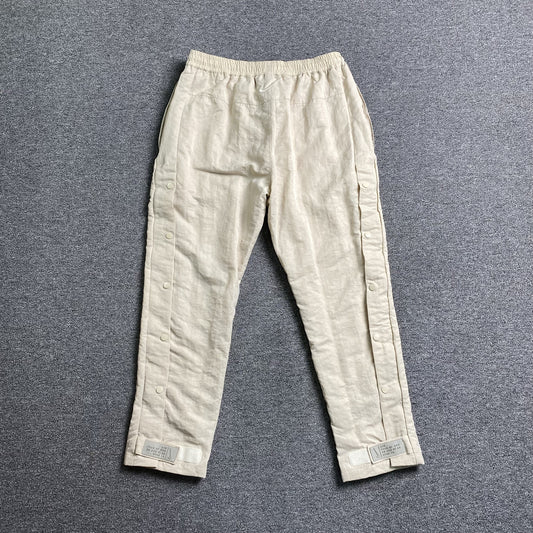 Pantalón Fear of God X Nike Nylon Crema