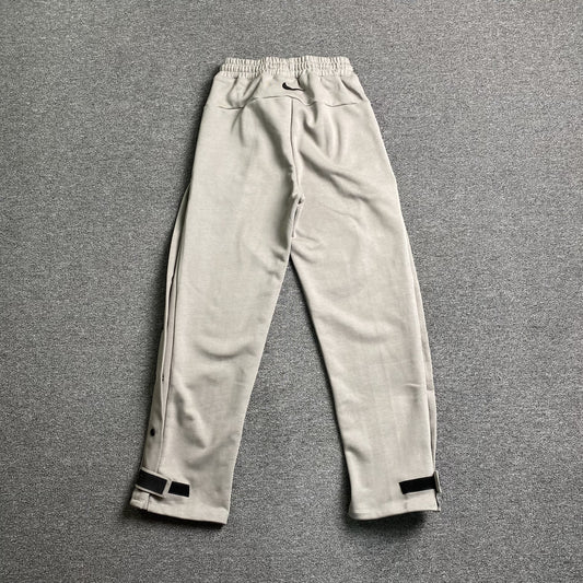 Pantalón Fear of God X Nike Tear Away Gris