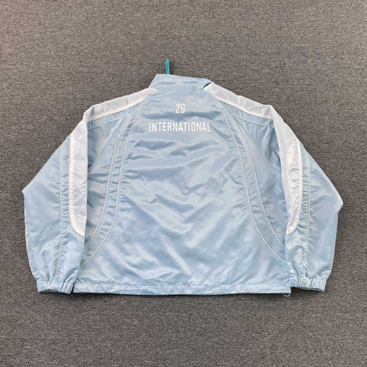 Campera Supreme Satin Piping Pullover Celeste