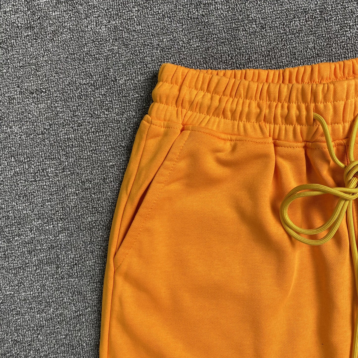 RHUDE X MCLAREN SHORTS ORANGE