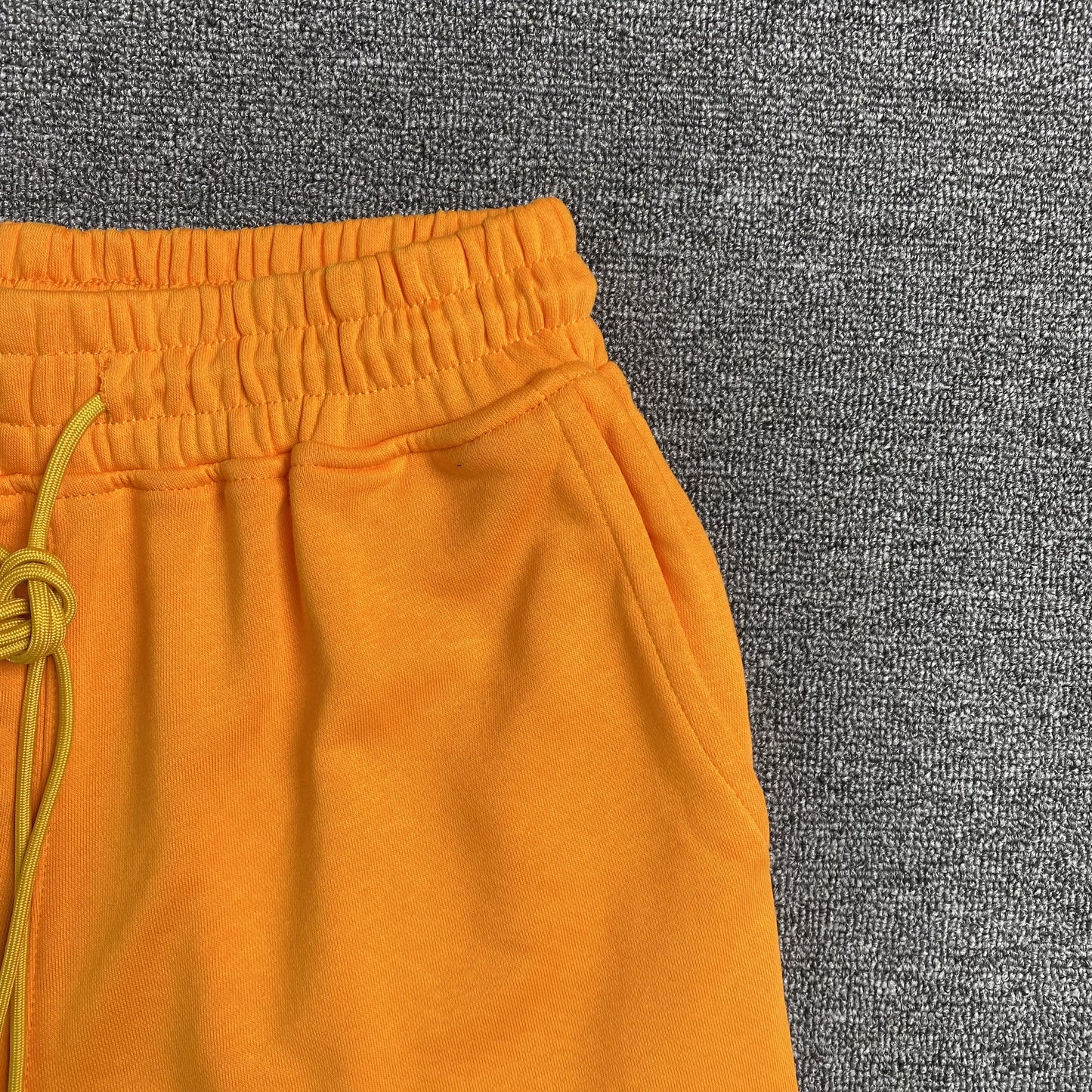 RHUDE X MCLAREN SHORTS ORANGE