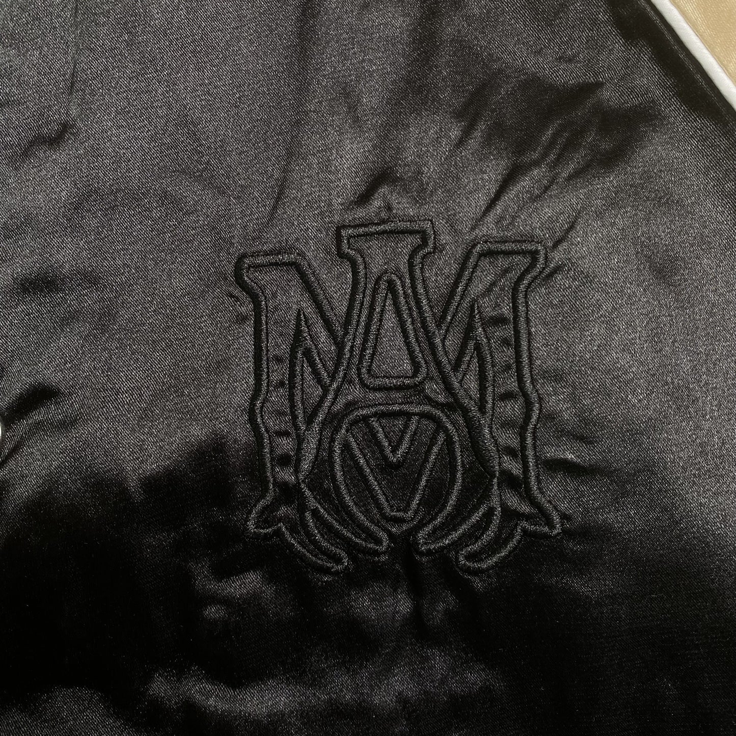 amiri-satin-flames-souvenir-varsity-bomber-jacket-black-3-Drip Store Argentina