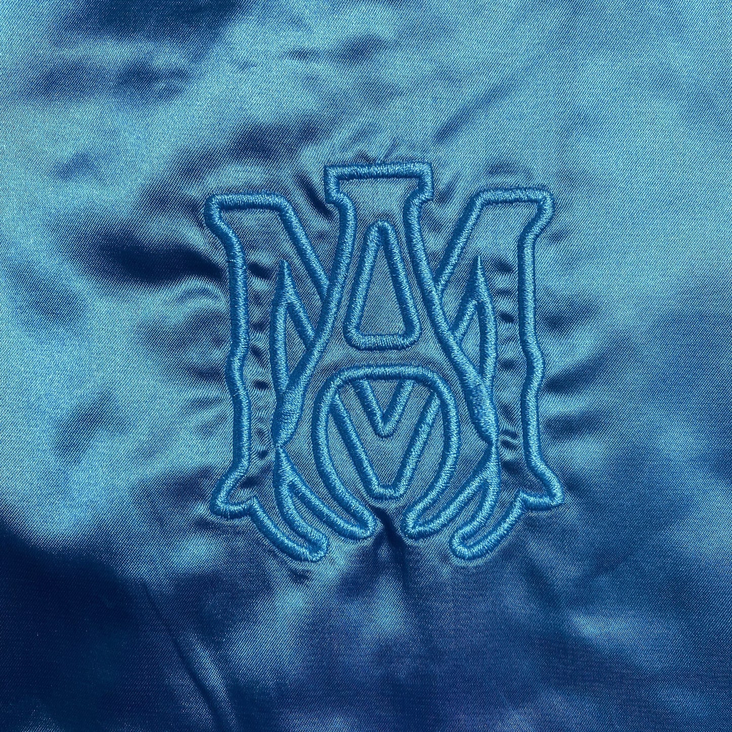 amiri-satin-flames-souvenir-varsity-bomber-jacket-blue-3-Drip Store Argentina