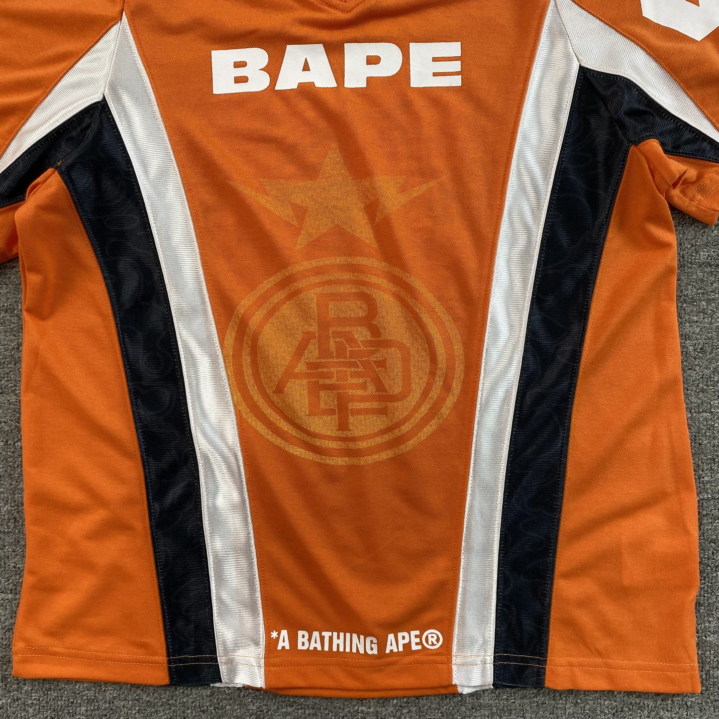 Remera Bape Multi Logo Soccer Jersey Naranja