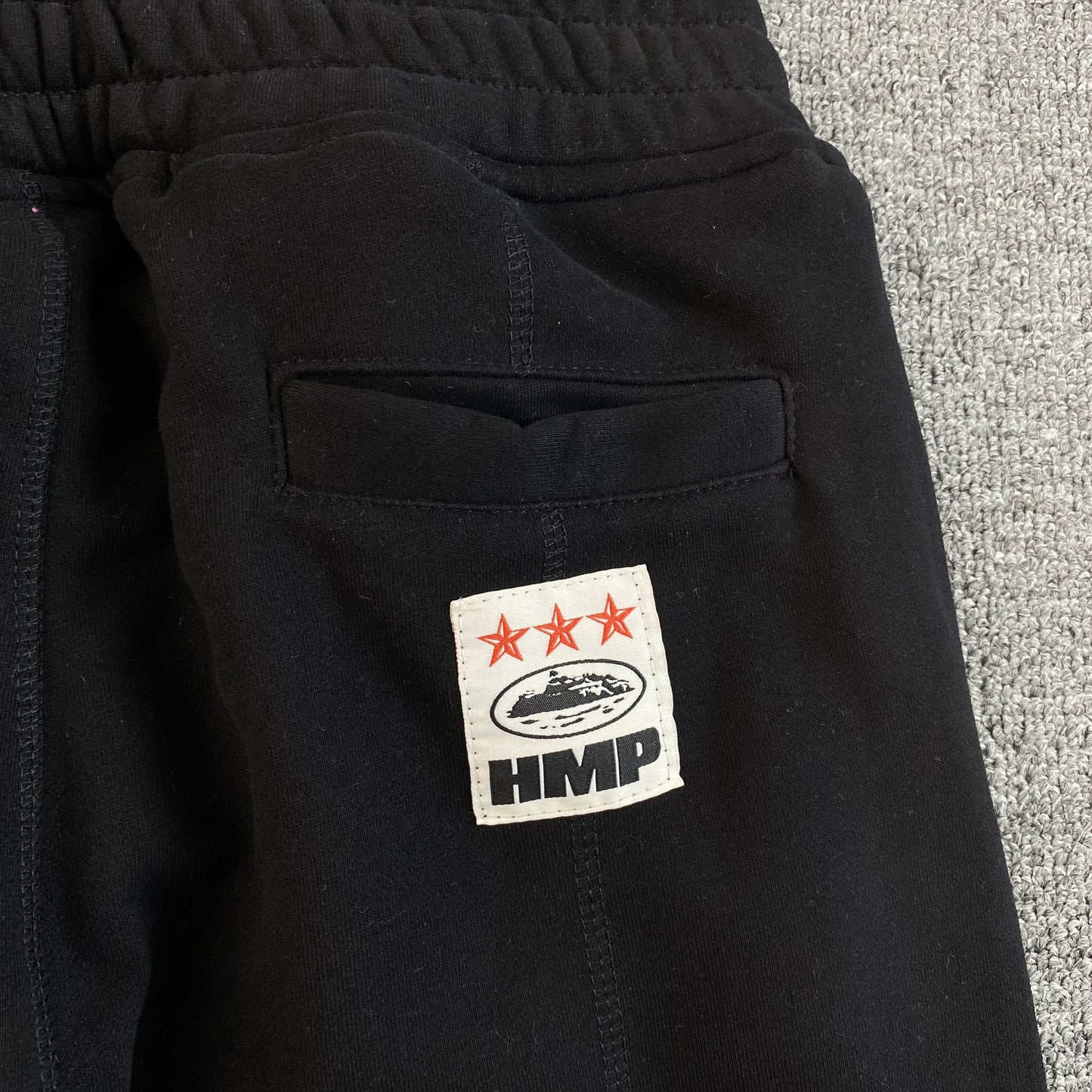 Pantalon Corteiz HMP Open Hem Negro