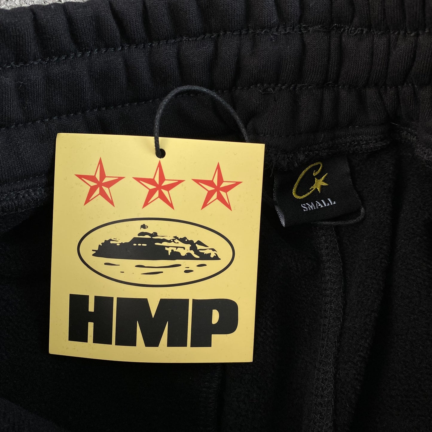 Pantalon Corteiz HMP Open Hem Negro