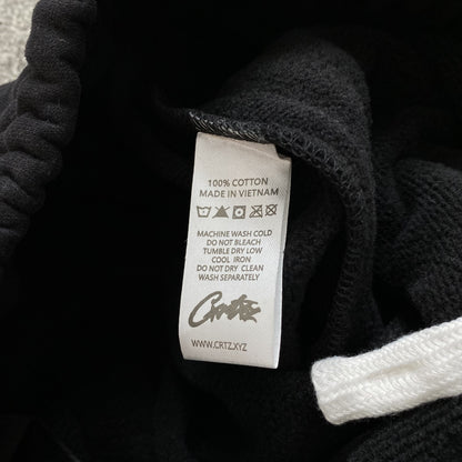 Pantalon Corteiz HMP Open Hem Negro