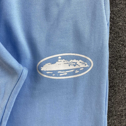 Pantalon Corteiz Island Puff Print Open Hem Celeste