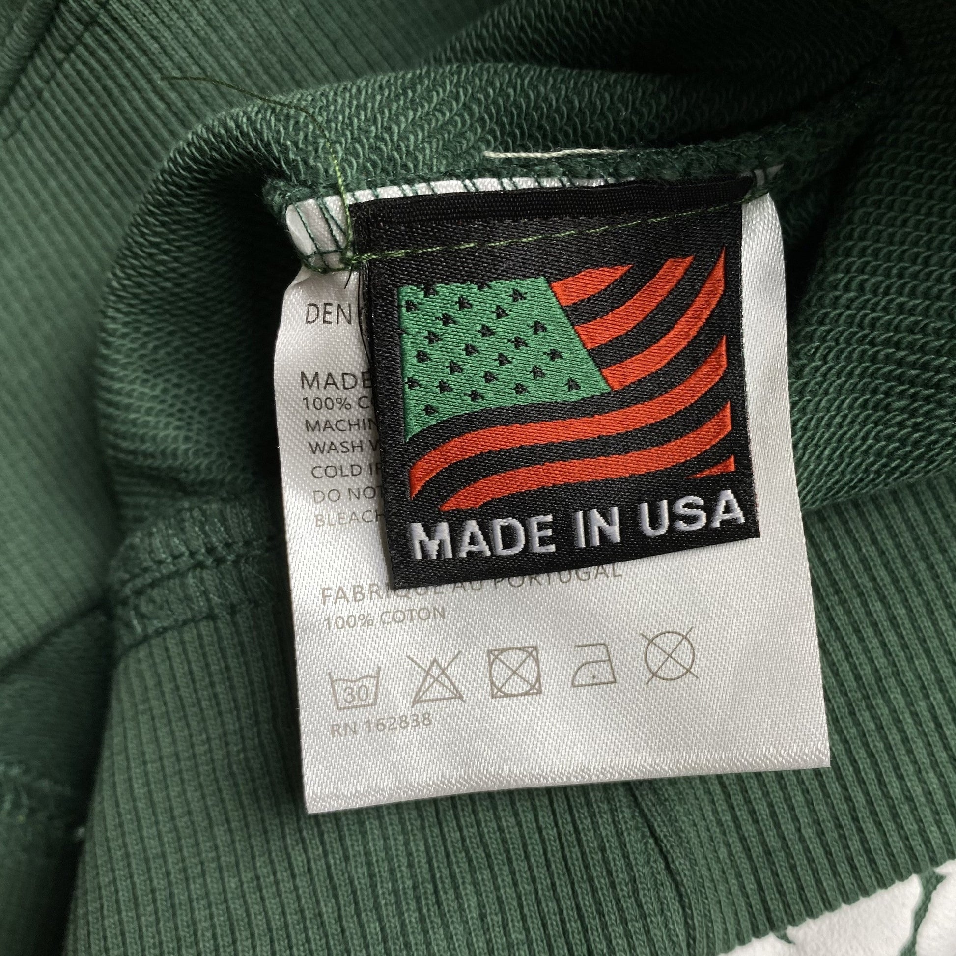 denim-tears-the-cotton-wreath-hoodie-green-3-Drip Store Argentina