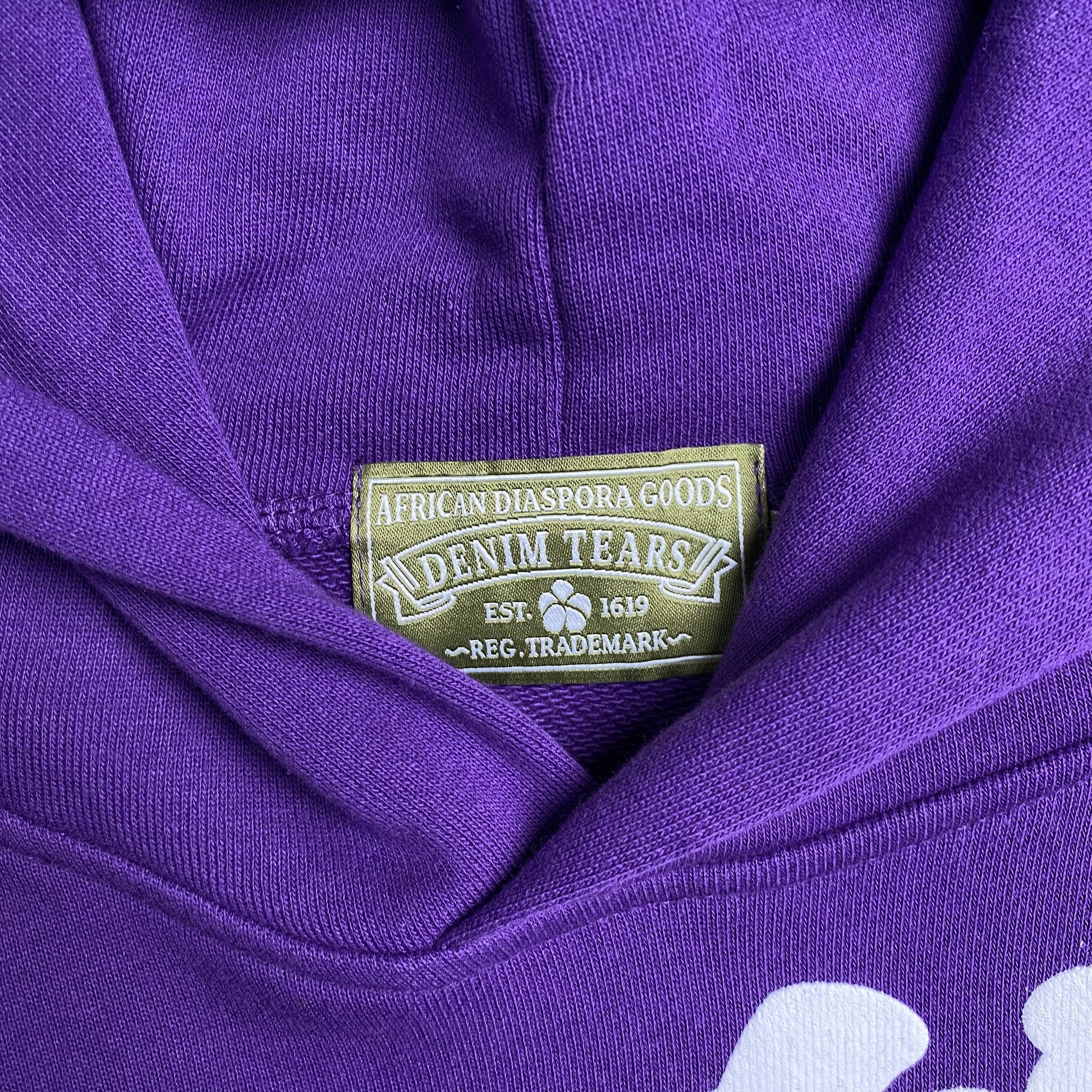 denim-tears-the-cotton-wreath-hoodie-purple-5-Drip Store Argentina