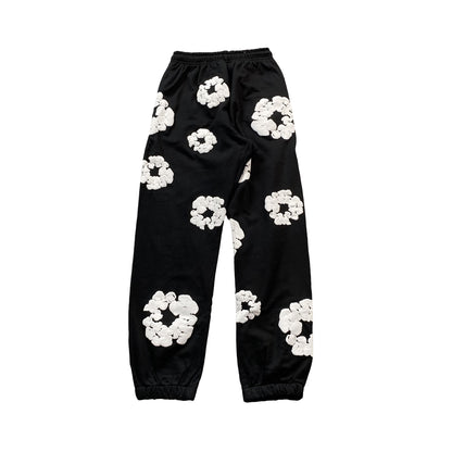 denim-tears-the-cotton-wreath-sweatpants-black-2-Drip Store Argentina