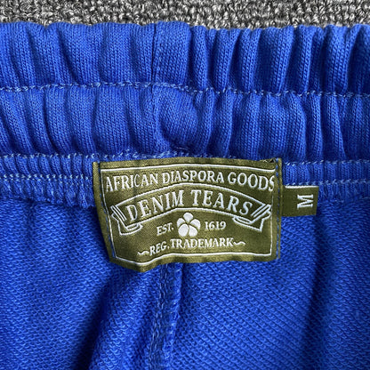 denim-tears-the-cotton-wreath-sweatpants-royal-blue-4-Drip Store Argentina
