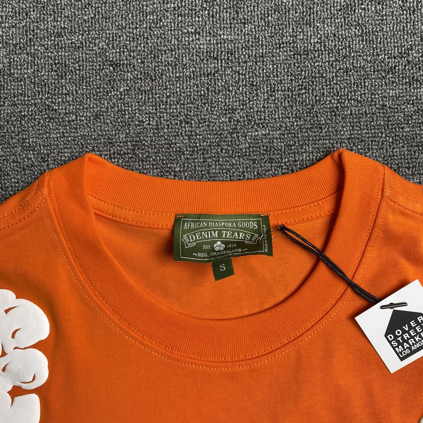 denim-tears-the-cotton-wreath-tee-orange-3-Drip Store Argentina