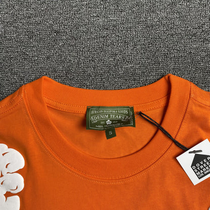 denim-tears-the-cotton-wreath-tee-orange-3-Drip Store Argentina