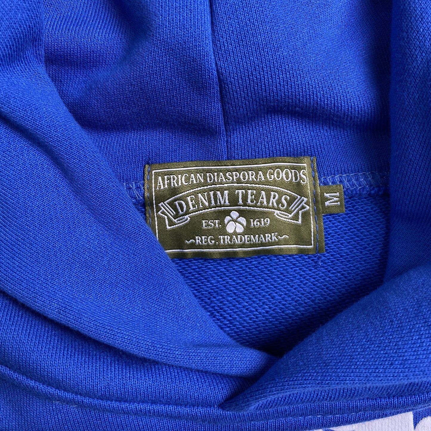 DENIM TEARS THE COTTON WREATH HOODIE ROYAL BLUE