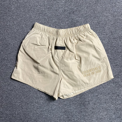 fear-of-god-essentials-running-nylon-short-egg-shell-Drip Store Argentina