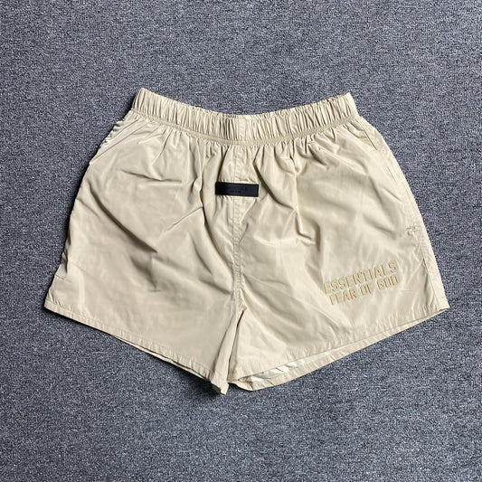 fear-of-god-essentials-running-nylon-short-egg-shell-Drip Store Argentina