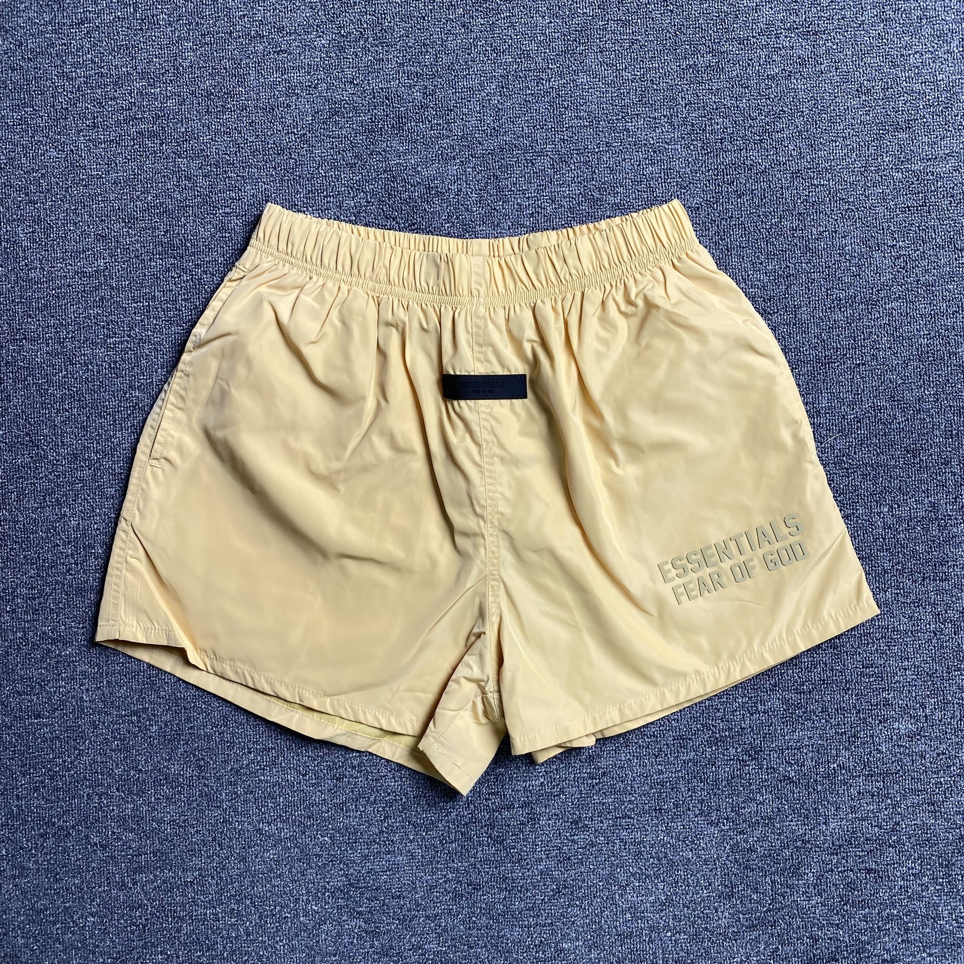 fear-of-god-essentials-running-nylon-short-light-tuscan-Drip Store Argentina