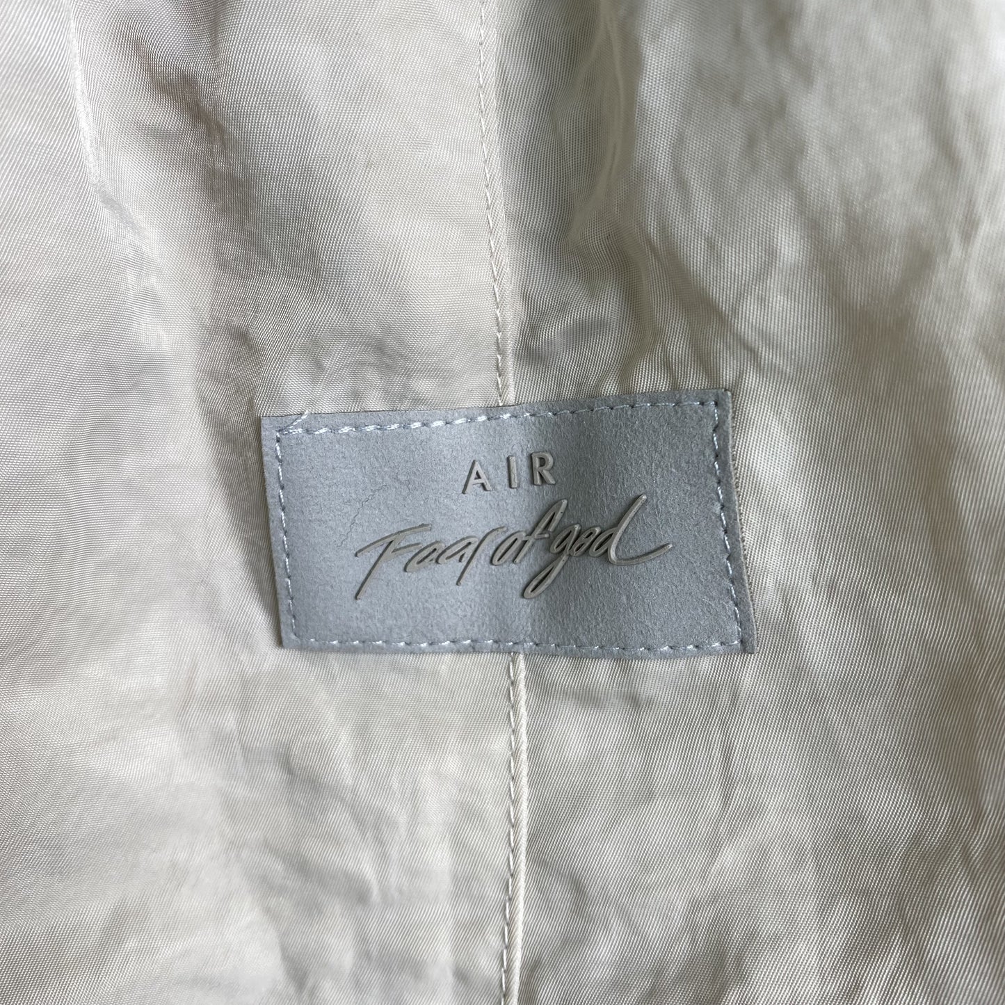 Pantalón Fear of God X Nike Nylon Crema