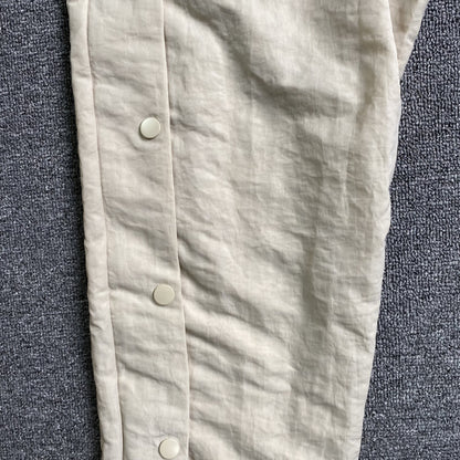 Pantalón Fear of God X Nike Nylon Crema