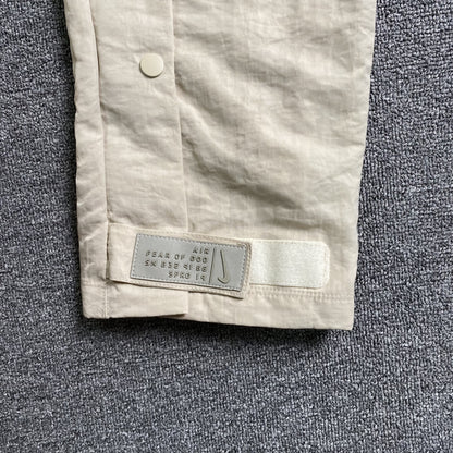 Pantalón Fear of God X Nike Nylon Crema