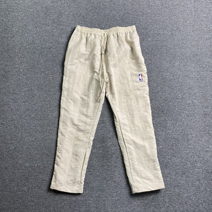 Pantalón Fear of God X Nike Nylon Crema
