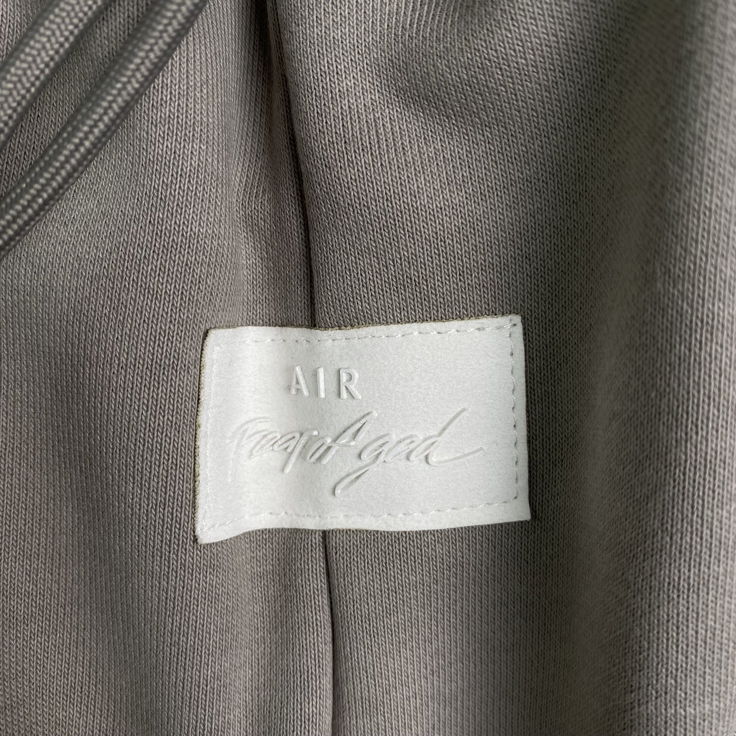 Pantalón Fear of God X Nike Tear Away Gris