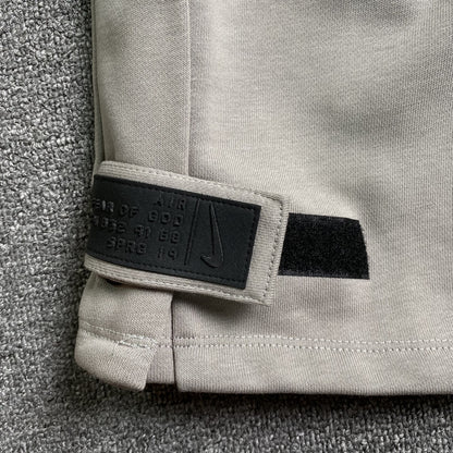 Pantalón Fear of God X Nike Tear Away Gris
