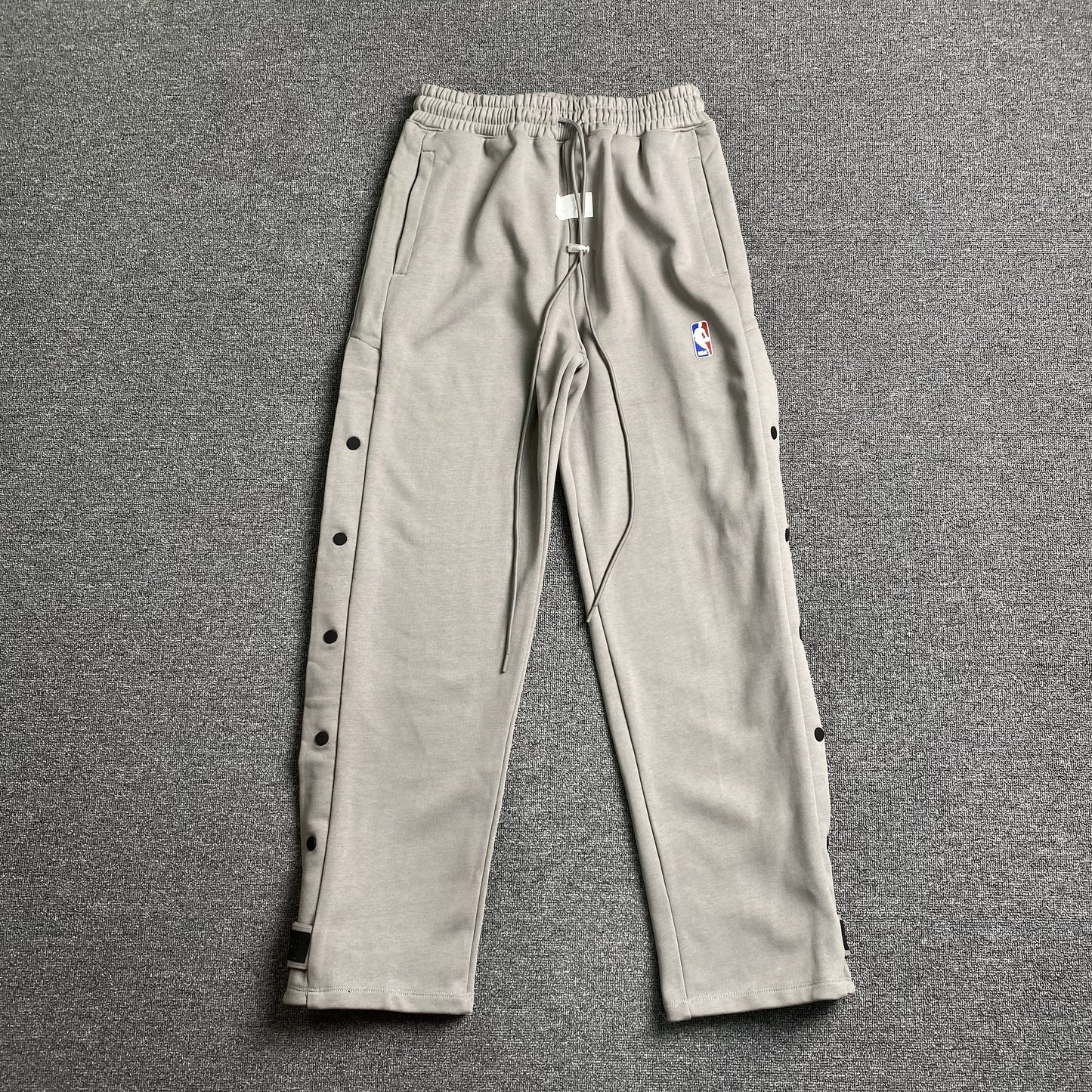 Pantalón Fear of God X Nike Tear Away Gris