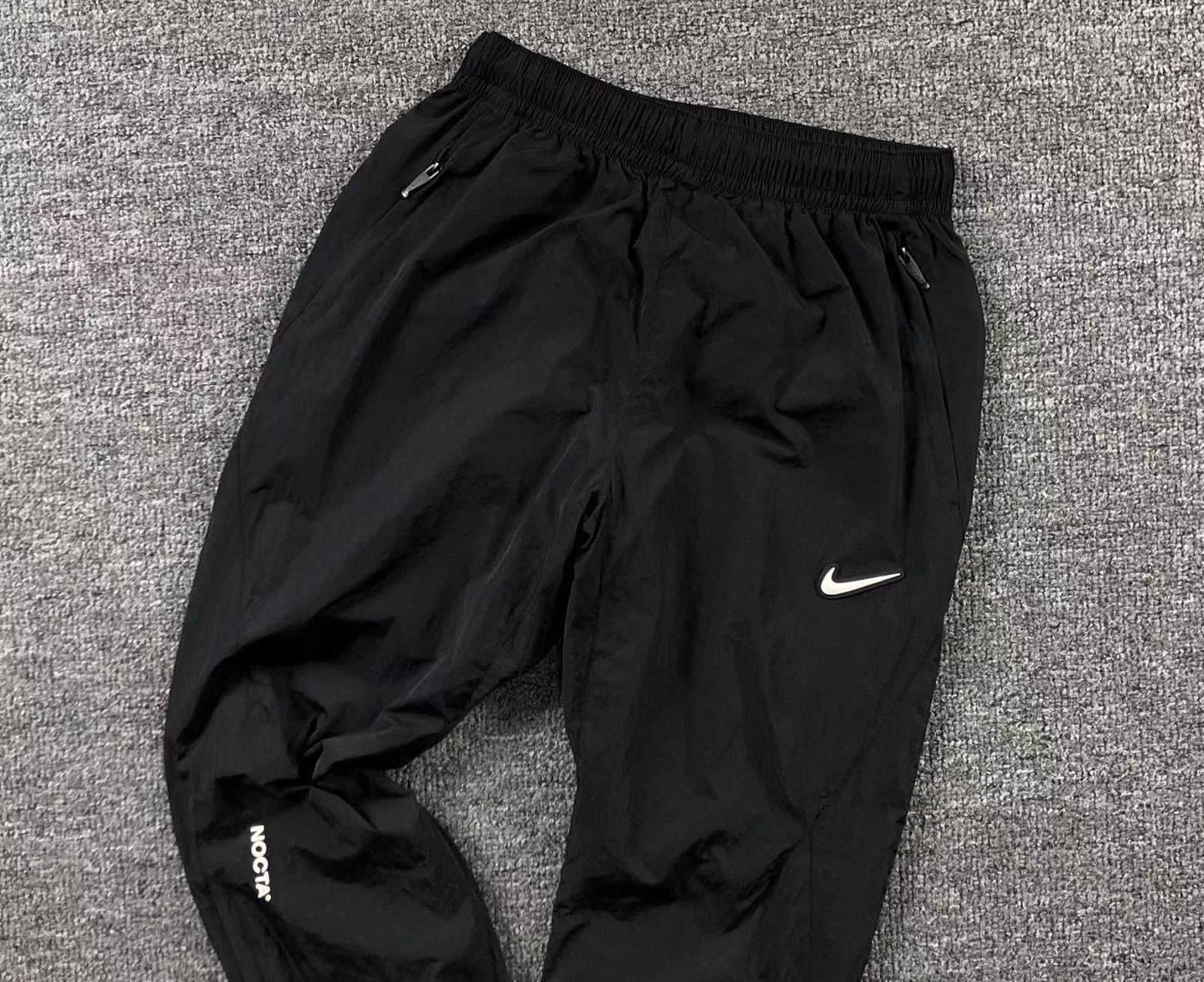 nike-x-drake-nocta-track-pants-black-7_f440e70f-Drip Store Argentina