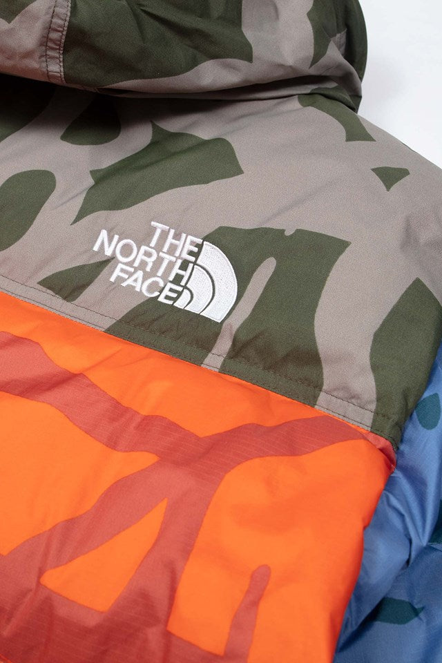 KAWS X THE NORTH FACE RETRO 1996 NUPTSE JACKET MOONLIGHT IVORY NUPTSE PRINT