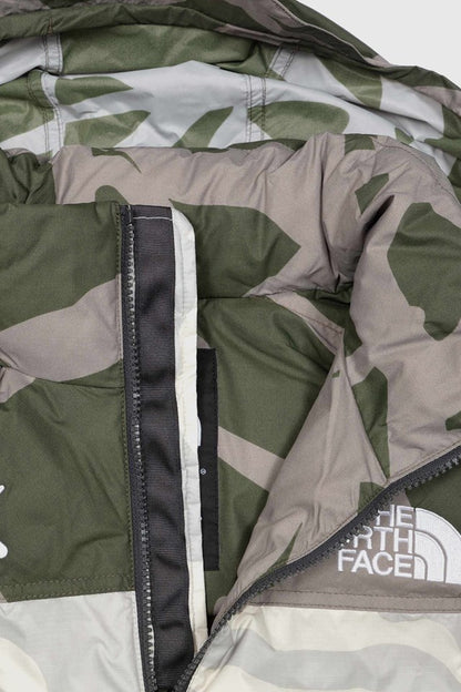 KAWS X THE NORTH FACE RETRO 1996 NUPTSE JACKET MOONLIGHT IVORY NUPTSE PRINT