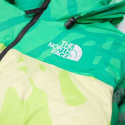 KAWS X THE NORTH FACE RETRO 1996 NUPTSE JACKET SAFETY GREEN NUPTSE PRINT