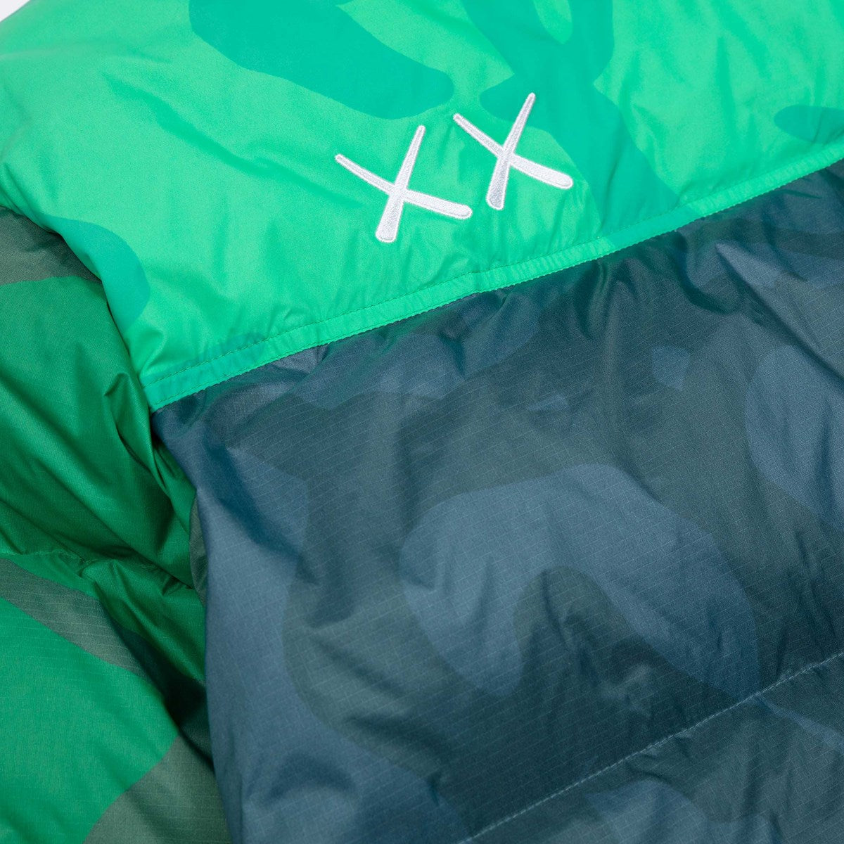 KAWS X THE NORTH FACE RETRO 1996 NUPTSE JACKET SAFETY GREEN NUPTSE PRINT