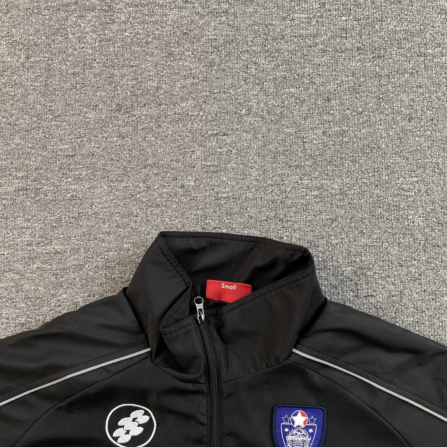 Campera Supreme Reflective Piping Pullover Negra