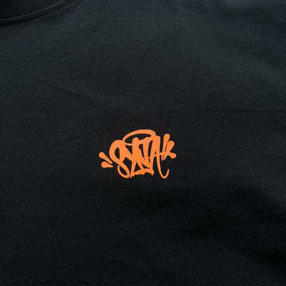 Remera Syna World Synarchy Negra Naranja