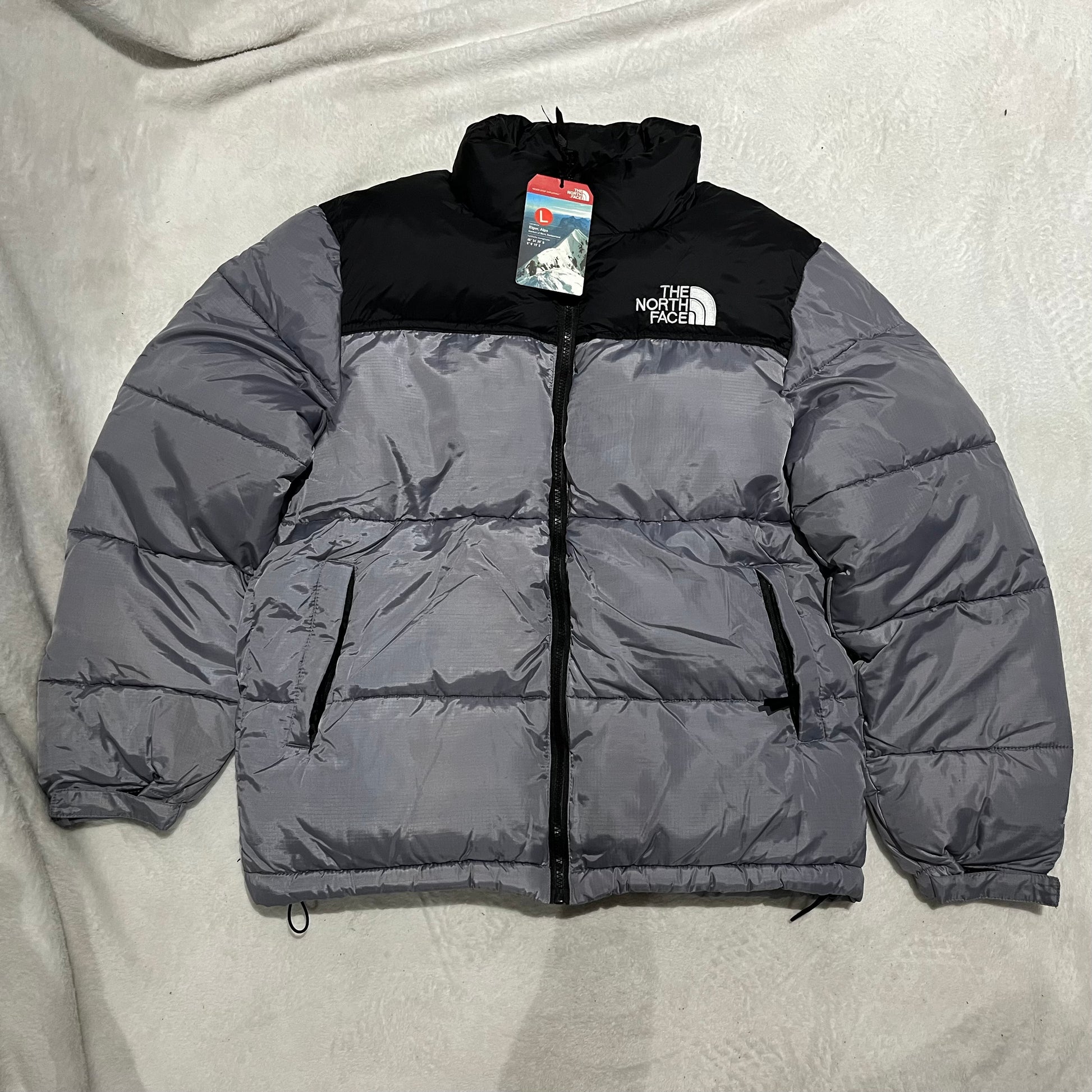 the-north-face-1996-retro-nuptse-700-fill-packable-jacket-grey-Drip Store Argentina
