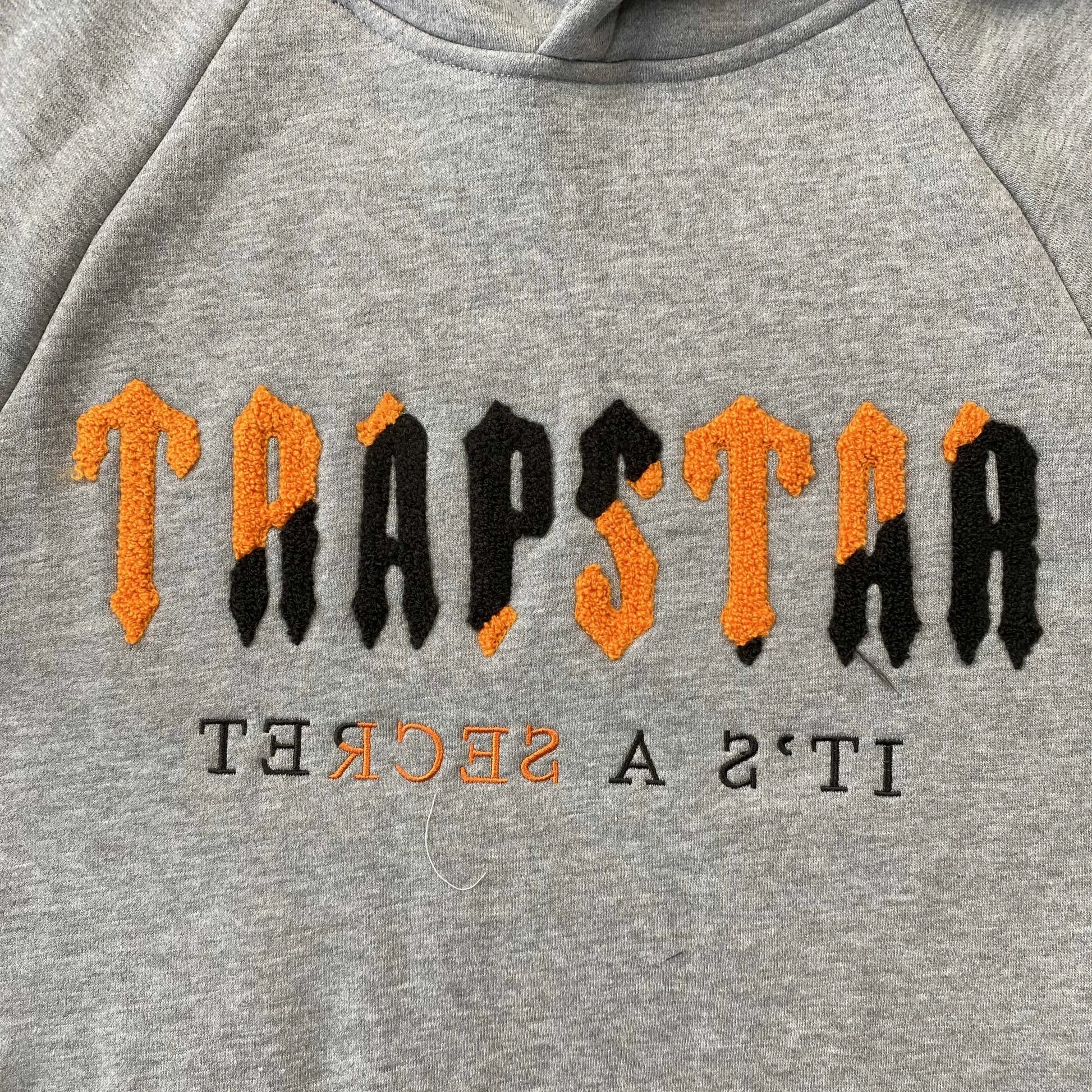 trapstar-chenille-decoded-tracksuit-grey-orange-2-Drip Store Argentina